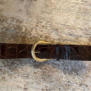 wide pleather belt with pattern design. Sized to 30 inch waist.